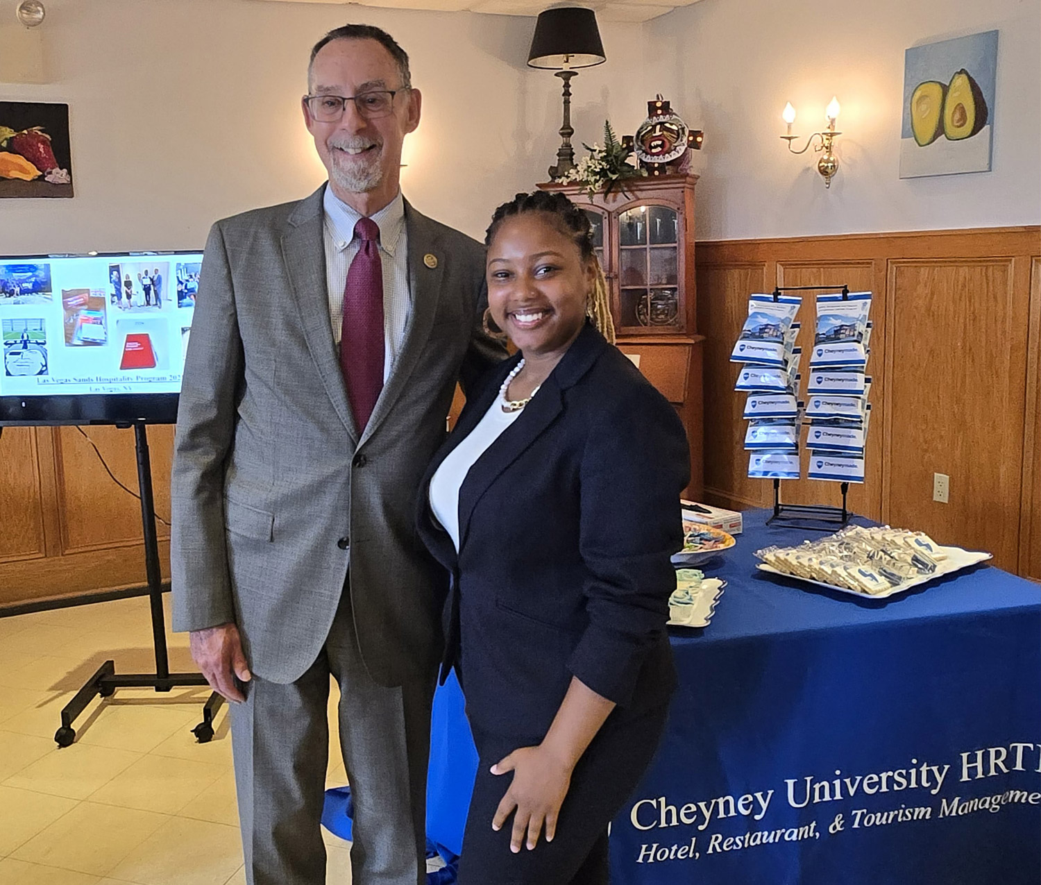 A Cheyney University student shows Chancellor Fiorentino a hotel, restaurant and tourism management facility at Cheyney University.