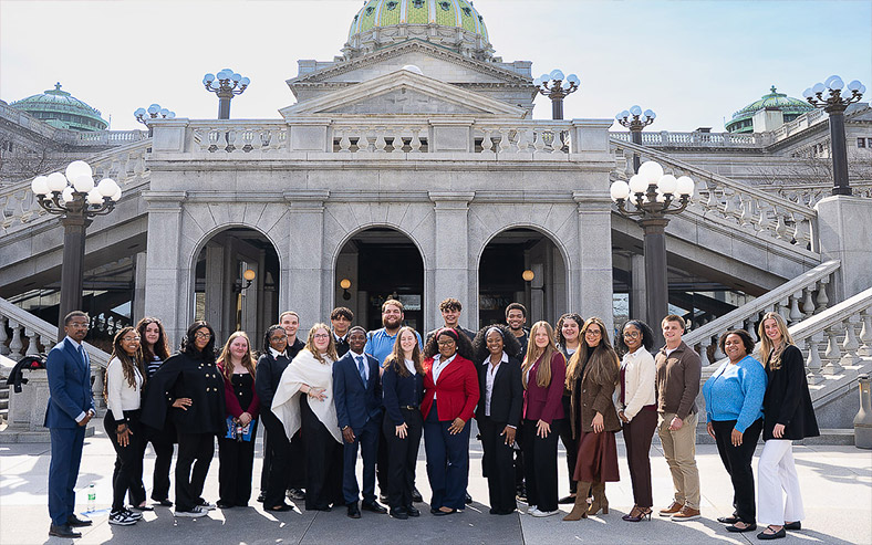 East Stroudsburg University Student Government Association members pose at the East Wing entrance to the state Capitol.