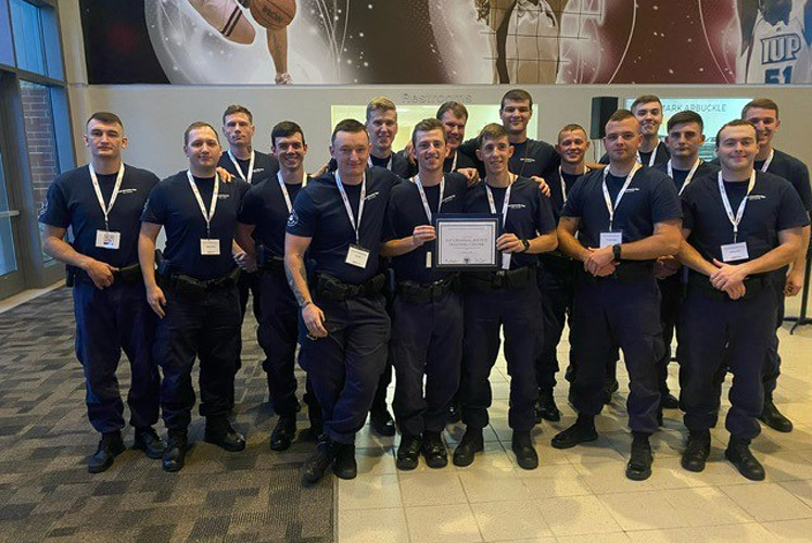 Cadets from the IUP Criminal Justice Training Center hold a certificate of appreciation in recognition of the Crisis Intervention Training program.
