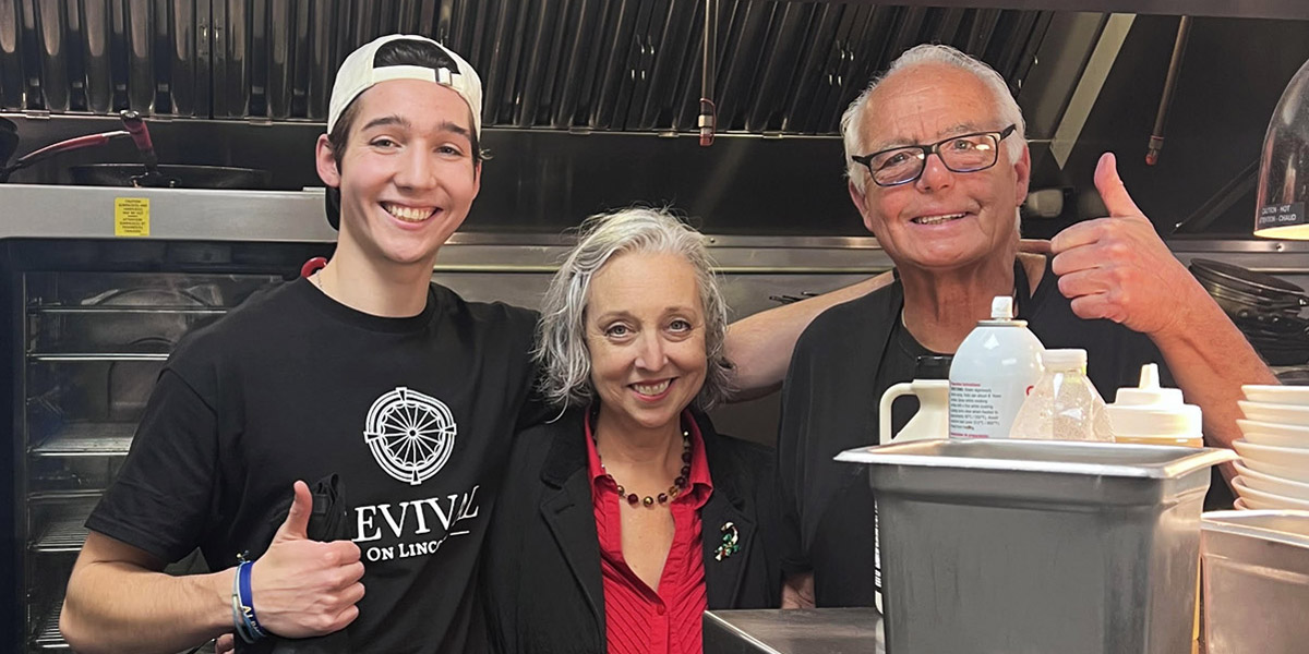 Brendan King and his parents in their family-owned restaurant, Revival on Lincoln.