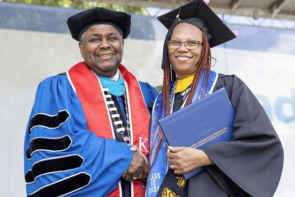 Cheyney University President Aaron Walton with paraprofessional graduate Kahn-Tineta Smith