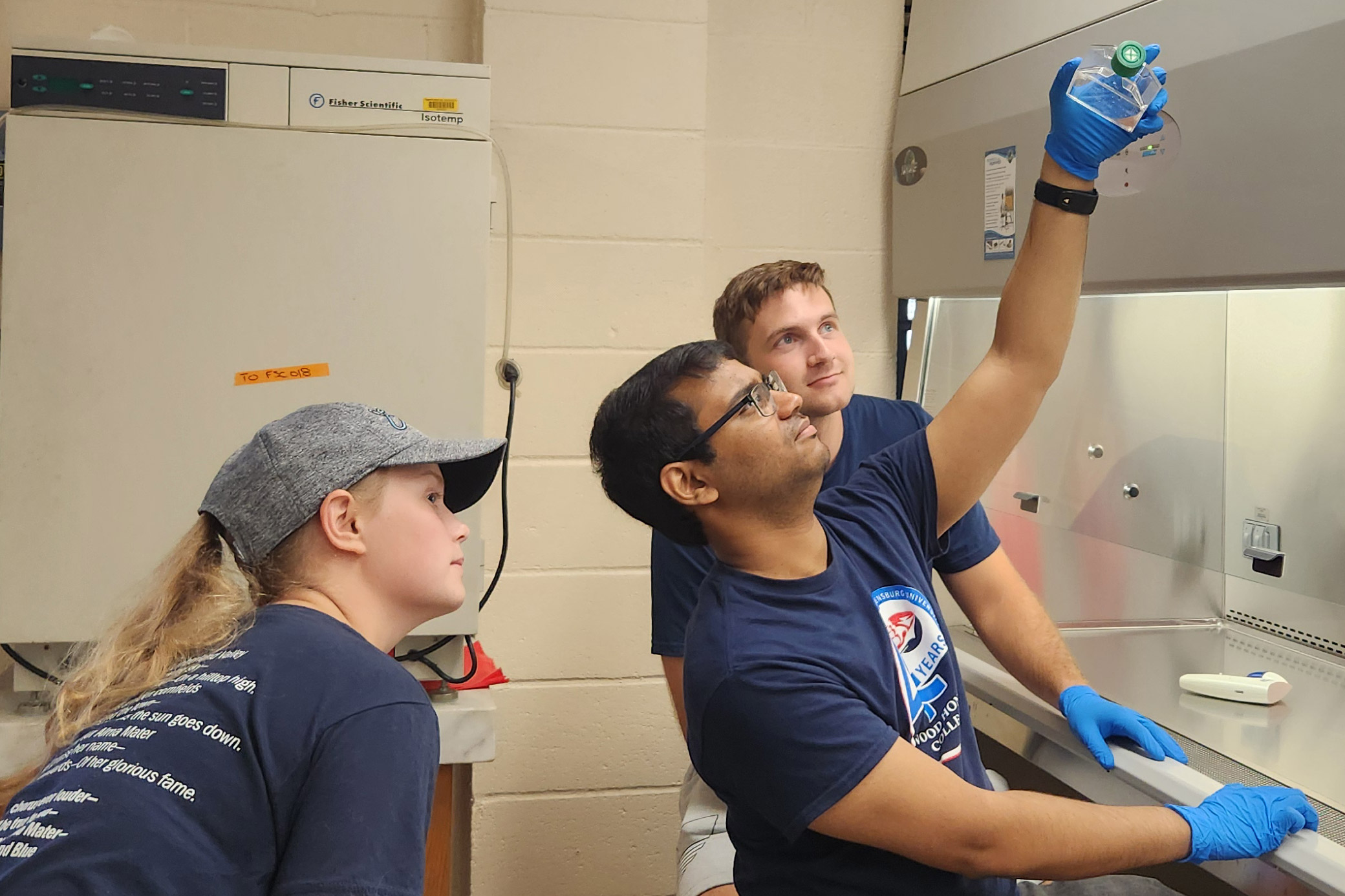 Shippensburg University biology majors, Aryan Gaonkar, Cameron Lyons and Aubrey McBride, in the lab