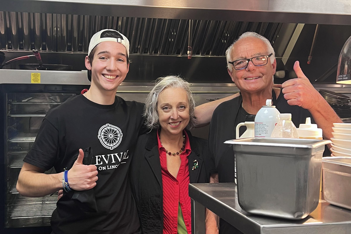 Brendan King with his parents at their family-owned restaurant, Revival on Lincoln.
