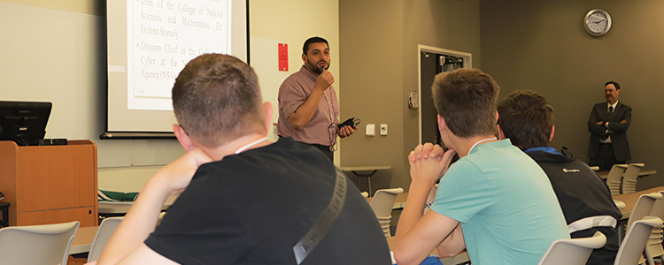 Waleed Farag lecturing to cybersecrity students